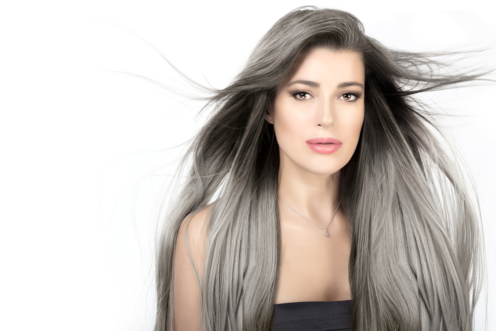 Young woman with long trendy silver hair