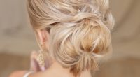 Rear view of female hairstyle middle bun with blond hair